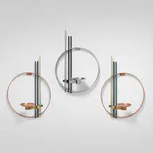 Circular wall-mounted candleholders, set of three by Walter von Nessen, c. 1930, copper, brass, chrome-plated copper, lacquered brass, sold Nov 2025