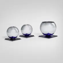 Russel Wright, Vase and candleholders, pair, c. 1950, chrome-plated metal, blue glass