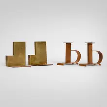 Chase Brass & Copper Co., Dee Handle candlesticks, model 21006 and bookends, model 11246, two pairs, lacquered copper, brass