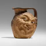 Double face jug by Robert Wallace Martin for Martin Brothers Pottery, 1911, salt-glazed stoneware, sold Jan 2024