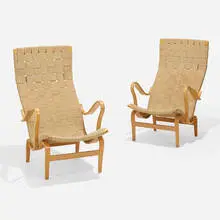 Pernilla 2 lounge chairs, pair by Bruno Mathsson, 1944 / 1976, laminated and steam-bent beech, canvas webbing, sold Nov 2025