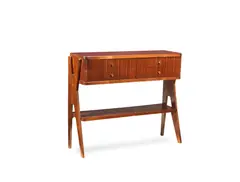 : A side table, designed and executed 1952 by Osvaldo Borsani, walnut, red-coloured glass top, slightly concave front with fluted details, offered Apr 2018