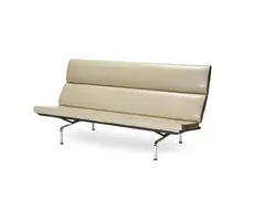and Ray Eames (American, 1912-1988) : compact sofa, designed 1940's, manufactured by Herman Miller from 1954 by Charles Eames, enamelled steel, chrome, vinyl upholstery, with fold-down back, offered Apr 2018