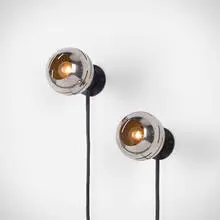 Wall lamps, pair by Angelo Lelii, c. 1968, chrome-plated and enameled steel, sold Nov 2025