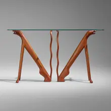 Judy Kensley McKie, Table with Dogs, 1979, carved and laminated mahogany, glass