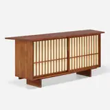 Sliding Door cabinet by George Nakashima, 1956, American black walnut, pandanus cloth, sold Sep 2023