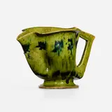 Pitcher by George E. Ohr, 1897-1900, glazed earthenware, sold Sep 2023