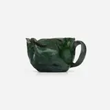 Mug by George E. Ohr, 1898-1910, glazed earthenware, sold Sep 2023