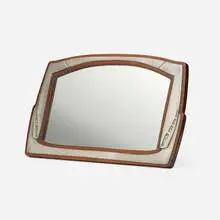 Archibald Knox, Tudric vanity mirror, c. 1905, carved mahogany, pewter, silvered glass, abalone shell