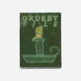 Grueby Faience Company, Advertising tile with chamberstick