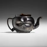 Teapot by George E. Ohr, 1897-1900, glazed earthenware, sold Sep 2023