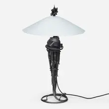 Comet table lamp by Albert Paley, 1999-2000, formed and fabricated carbon steel with a charcoal gray finish, frosted glass, sold May 2023
