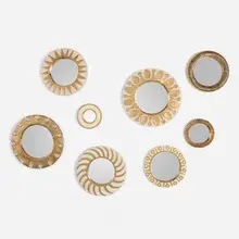 Mithé Espelt, Collection of eight wall mirrors, c. 1948-1975, glazed and gilt earthenware, mirrored glass