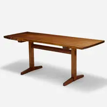 Trestle dining table by George Nakashima, 1974, American black walnut, sold May 2023