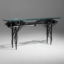 Console table by Albert Paley, 1989, forged and fabricated steel, glass, sold May 2023