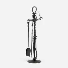 Forged fireplace tools by Albert Paley, 1996, forged and fabricated steel with a blackened finish, sold May 2023