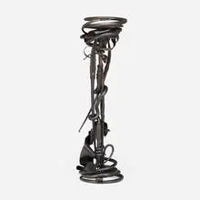 Plant stand by Albert Paley, 1990, forged and fabricated steel with a blackened finish, slate, sold May 2023