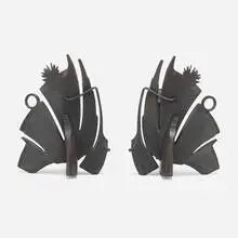 Andirons, pair by Albert Paley, 1996, forged and fabricated steel with a blackened finish, sold May 2023