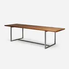 Custom dining table by Hudson Furniture, c. 2010, walnut, steel, sold Sep 2025