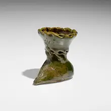 Boot vase by George E. Ohr, 1895-96, glazed earthenware, sold May 2023