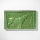 Rare Jungle Book tile with tapir and heron by Russell Crook for Grueby Faience Company, c. 1900, glazed earthenware, sold May 2023