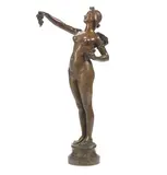 Maurice Bouval, 'Les Raisins', a patinated bronze figure of a female nude holding grapes, patinated bronze