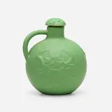 Early "fire water" jug with stopper, 1902 by Artus Van Briggle for Van Briggle Pottery, 1902, glazed earthenware, sold May 2023