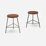 Stools from College of Architecture, Chandigarh, pair by Pierre Jeanneret, c. 1960, teak, painted steel, sold Sep 2025
