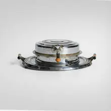 Manning Bowman & Co., Waffle iron, c. 1935, chrome-plated steel, aluminum, Bakelite