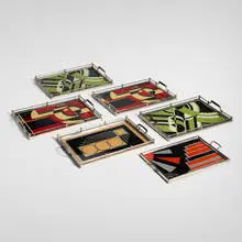Art Déco, Collection of six geometric trays, c. 1930, reverse-painted glass, chrome-plated metal, painted wood