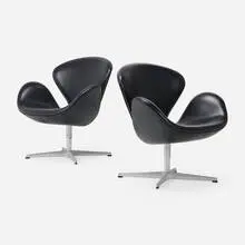 Swan chairs model 3320, pair by Arne Jacobsen, 1957 / 2006, leather upholstery, aluminum, chrome-plated steel, plastic, sold Aug 2025