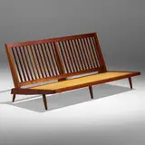 Double settee by George Nakashima, 1962, American black walnut, upholstery, sold Jan 2023