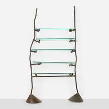 Unique and Custom shelf from Bazaar, London by Ron Arad, 1984, patinated steel, cast iron, glass, steel, sold Aug 2025