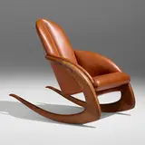 Crescent rocker by Wendell Castle, 1978, walnut, leather, sold Jan 2023