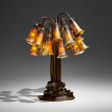 Tiffany Studios, Eighteen-light Lily table lamp, c. 1910, patinated bronze, hand-blown Favrile glass