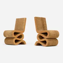 Wiggle chairs, pair by Frank Gehry, 1972, laminated cardboard, Masonite, sold Aug 2025