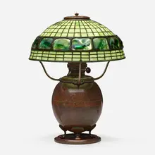 Turtleback table lamp by Tiffany Studios, c. 1910, leaded glass, Favrile glass, patinated bronze, sold Jan 2023