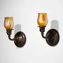 Sconces, pair by Tiffany Studios, c. 1910, patinated bronze, hand-blown Favrile glass, sold Jan 2023