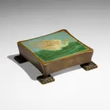 Trivet with seagull by Grueby Faience Company, 1898-1910, glazed earthenware decorated in cuenca, patinated bronze, sold Jan 2023
