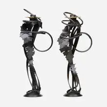 Double Shear candleholders, pair by Albert Paley, 2014, forged mild steel with a blackened patina, removable brass bobeches (collars), sold Sep 2022