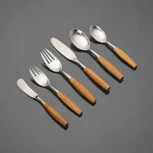 Fjord flatware by Jens Quistgaard, teak, stainless steel, sold Jul 2025