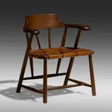 Captain's chair by Wharton Esherick, c. 1966, oak, leather, sold Sep 2022