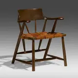 Captain's chair by Wharton Esherick, c. 1966, oak, leather, sold Sep 2022