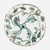 Quatre Profils Enlacés plate by Pablo Picasso, 1949, glazed earthenware with engobe decoration, sold Sep 2022
