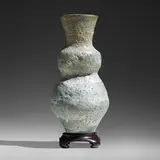 Large bottle by Lucie Rie, c. 1980, manganese volcanic-glazed stoneware, sold Sep 2022