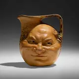 Double face jug by Robert Wallace Martin for Martin Brothers Pottery, 1903, salt-glazed stoneware, sold Sep 2022