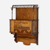 Marquetry wall-hanging cabinet by Émile Gallé, c. 1900, mahogany, mixed wood inlay, sold Sep 2022