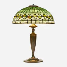 Vine Border table lamp by Tiffany Studios, c. 1910, leaded glass, patinated bronze, sold Sep 2022