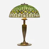 Vine Border table lamp by Tiffany Studios, c. 1910, leaded glass, patinated bronze, sold Sep 2022