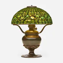 Vine Border table lamp by Tiffany Studios, c. 1910, leaded glass, patinated bronze, sold Sep 2022